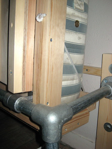 Rope replaces latches holding the head end of the wallbed round the mattress (upright position)