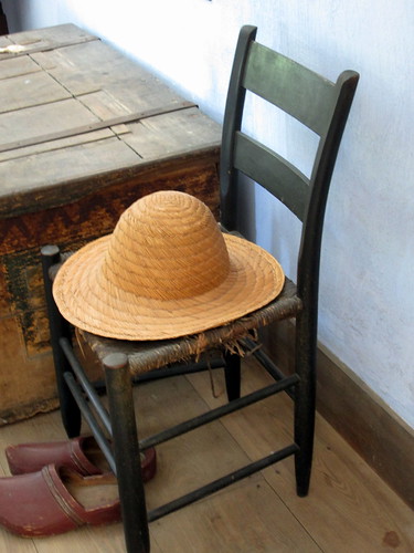 Straw Hat, Shoes And An Old Chair.