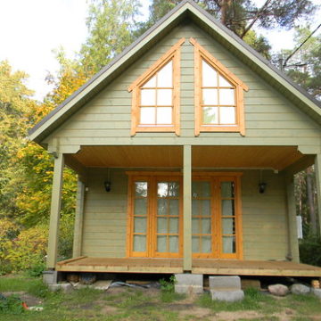 Front of tall log cabin