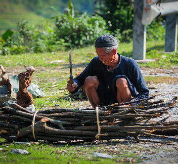 An old man working on rural road