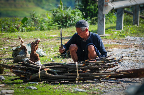 An old man working on rural road