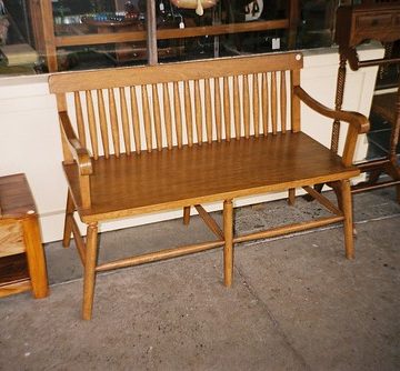 A wooden bench to sit on