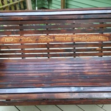 My diy porch swing with stained inscription: