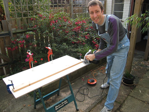 Day 5: Me wielding the circular saw in the garden