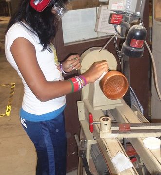 M.B. finishing a Wooden Bowl from Coconut Palm