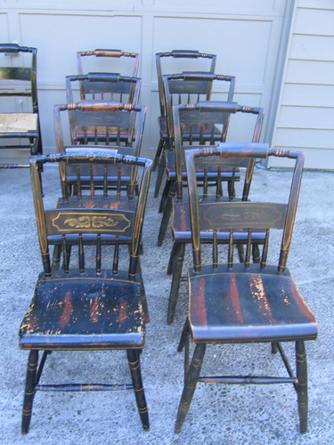 eight wooden-seated chairs