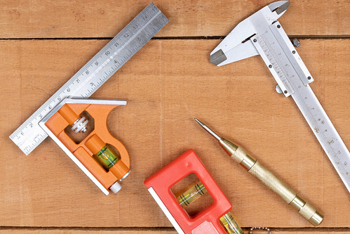 Woodworking Measuring Tools on the wooden table background