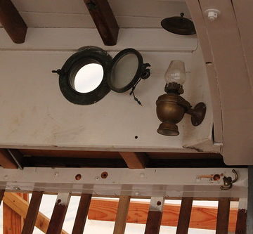 Port Hadlock WA - Boat School - FELICITY ANN - interior with portlight and oil lamp