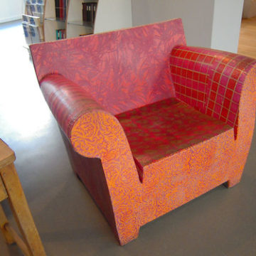 Decoupaged wooden chair in a paper shop, Manchester, UK