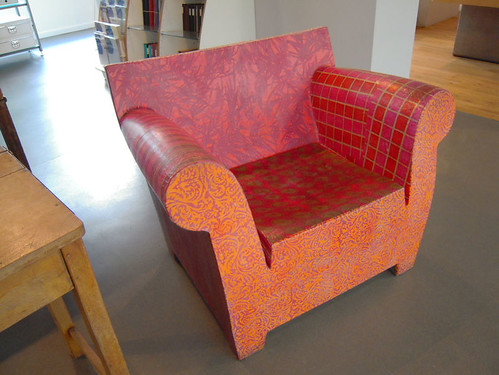 Decoupaged wooden chair in a paper shop, Manchester, UK