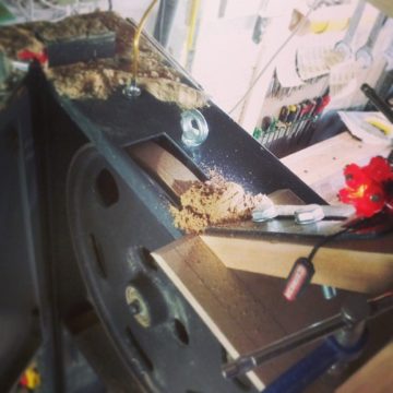 #truing a #bandsaw #tyre or #tire with a #handplane #blade #jig #cork #rubber #wheel #scraping #sawdust #shavings #balance #woodworking #workshop #woodshop #machinery #saw #idea #innovation