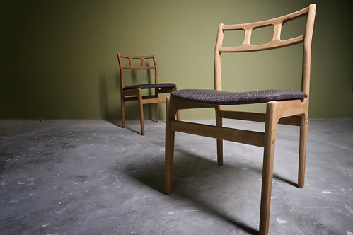 A pair of wooden dining chairs