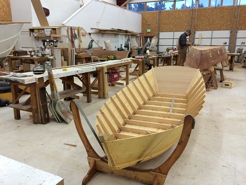 IMG_1389 - Port Hadlock WA - Northwest School of Wooden Boatbuilding - Hammond Shop - foreground - Light McKenzie River Boat - background -Ernie Baird at work on his Nelson D Gillett-designed BEACHCOMBER skiff