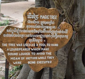 Cambodia.  Phnom Penh. Choeung Ek Genocidal Centre. The Magic tree.  A speaker was hung here to drown the noise of victims.