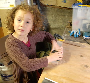 Ellie Sanding a Table Piece