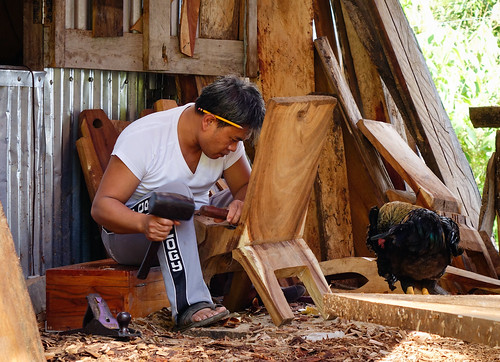 Carpenter working at the wood factory