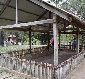 Cambodia.  Phnom Penh. Choeung Ek Genocidal Centre. Tokens on the posts left by visitors in respect for what happened here.