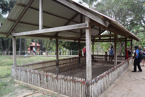 Cambodia.  Phnom Penh. Choeung Ek Genocidal Centre. Tokens on the posts left by visitors in respect for what happened here.