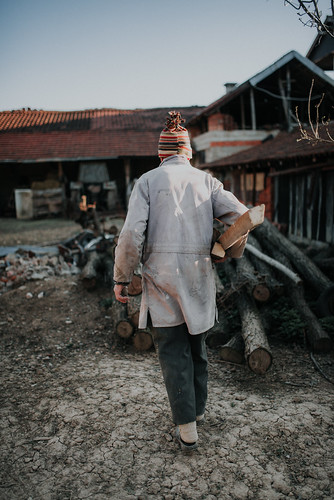 Old woodworker at home