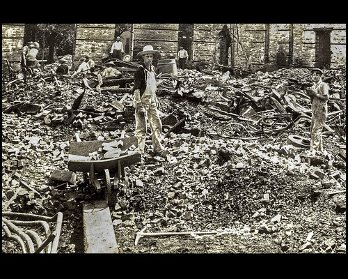 Cleaning up after the 1903 fire at the factory. Many of the bricks were re-used. The description is from an article in the local newspaper in 1903.