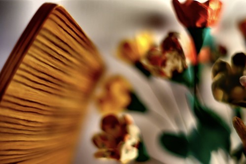 wooden chair and artificial flowers