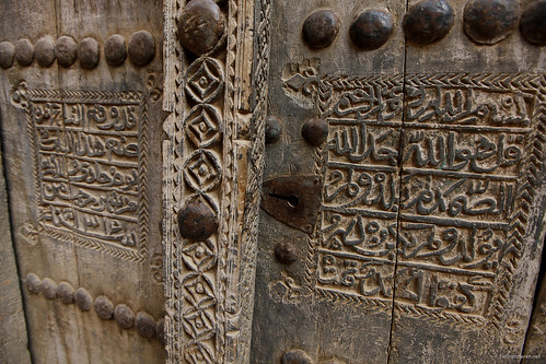 Woodwork on a mudhouse door in deserted Al Hamra.