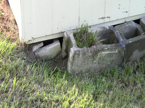 Blocks in sinkhole under shed