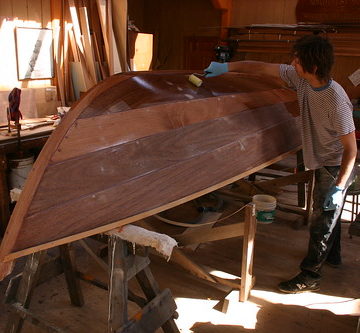 Port Hadlock WA - Boat School - Contemporary - Whilly Boat - Sam rolls on a coat of epoxy