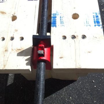 Pipe clamp and bench dog holes