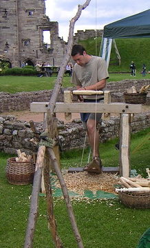 Simple treadle-operated wood turning lathe