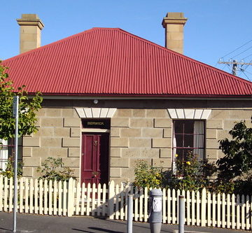 Hobart. Old stone square cottage in Battery Point. From the 1820s. Named Berwick.