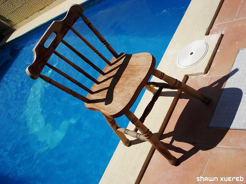 poolside wooden chair