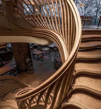 A sculptural wood spiral staircase