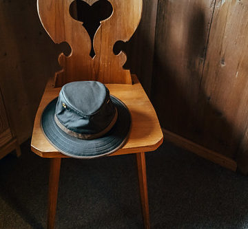 Old hat on wooden chair