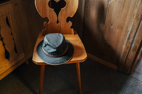 Old hat on wooden chair